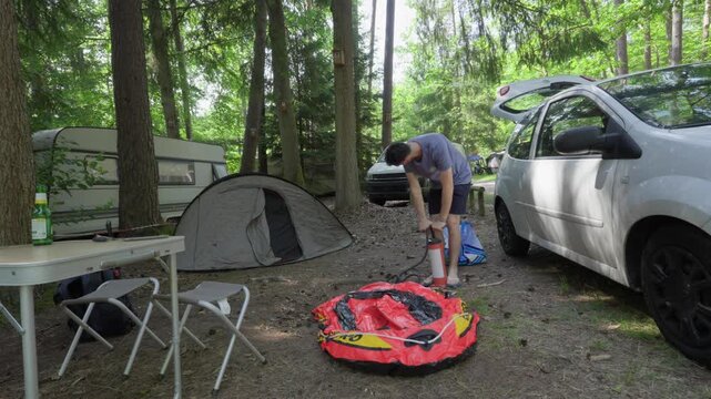 Inflating a Inflatable Boat outdoor wild car camping near Lake Hanau in France