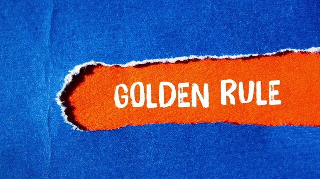Golden rule message writing on ripped torn paper background