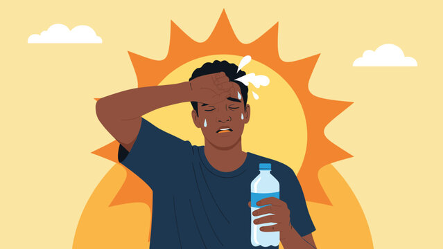 Young man suffers from the intense heat of a bright summer sun while sweating profusely and holding a plastic bottle of refreshing water.