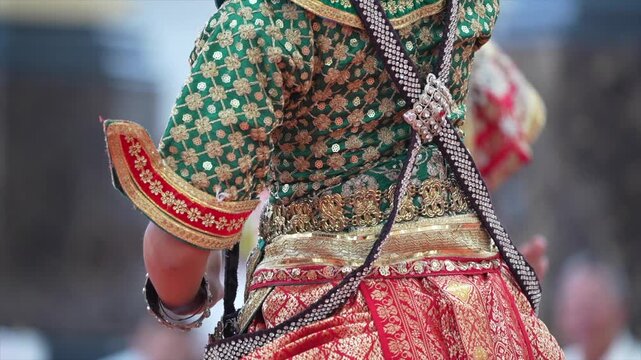 Traditional Thai dance close perspective focusing on expressive hand and foot gestures with intricate costume details and cultural performance style.