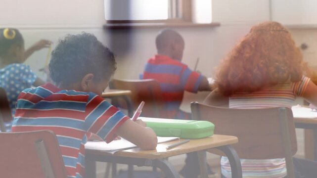 Animation of crayons over back of diverse writing test at school