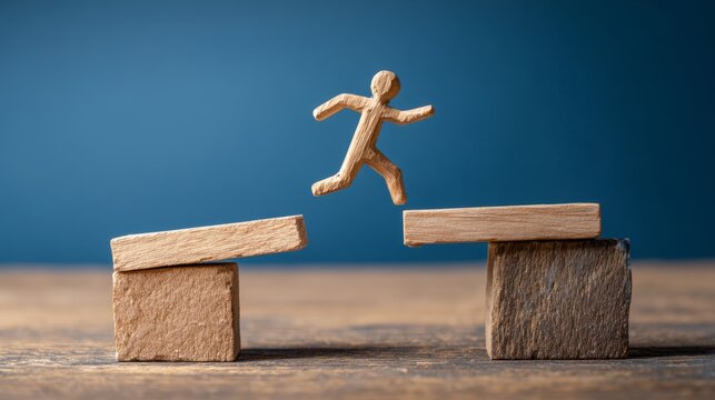 Wooden figure jumping over gap opportunity bridge risk challenge success motivation determination overcoming obstacle blue background concept