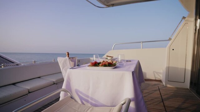 Romantic Dinner Setup on Luxury Boat Deck with Infinite Sea Horizon