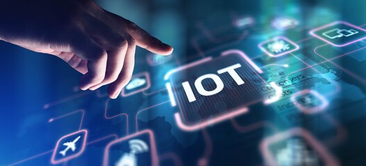 IoT Internet of Things Connecting Devices and Enabling Smart Solutions, projection on a virtual screen, Business and Technology Concept. © WrightStudio