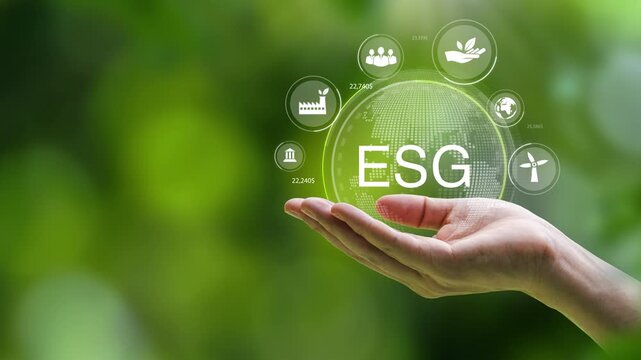 ESG concept with human hand holding digital globe with icons of green business, environment, social and governance sustainability.