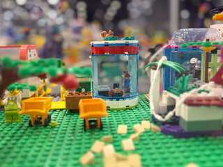 Fototapeta premium Colorful lego minifigure scene on green baseplate