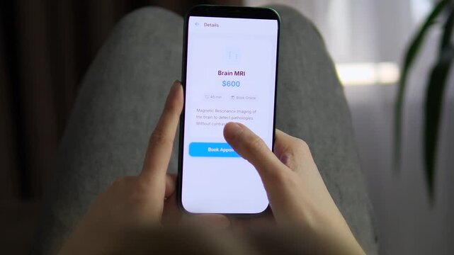 Close-up of a patient booking a Brain MRI via a sleek telehealth app. Scrolling through medical services and selecting a scan. Perfect for medtech, modern healthcare, and digital transformation