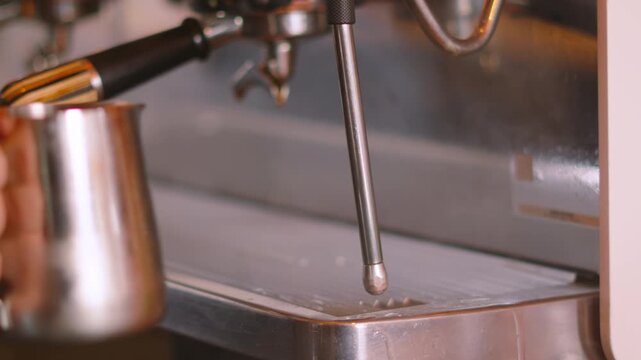 Milk Frother Prepped with Steam Coming Out in Slow Motion Before Barista Moves Jug to Froth and Make Flat White Coffee in Cafe. Independent Business Clip.