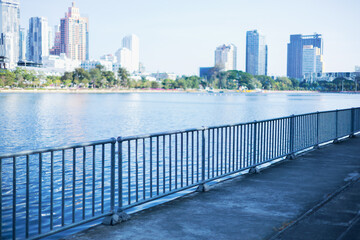 Bridge railing along the lake at Benjakitti Park, greener Bangkok, Thailand.
