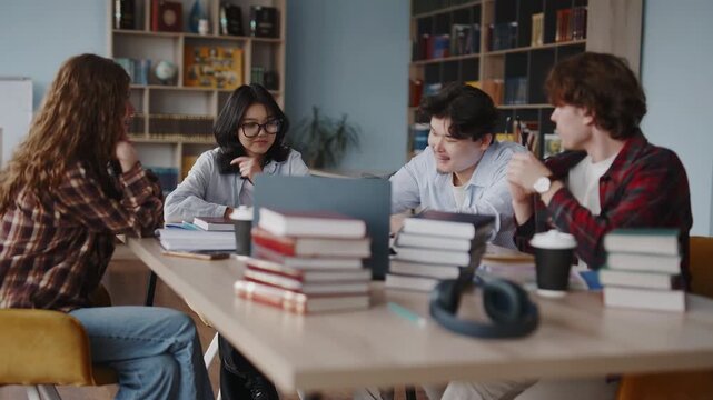 Diverse students collaborating on a group project in a university library