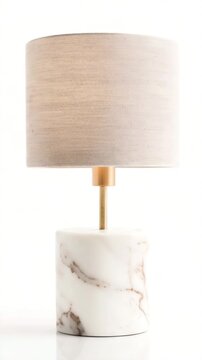 Lamp features a marble base and a fabric shade in a neutral color. Light shines from the lamp, adding illumination to the room. Focus on design and material quality