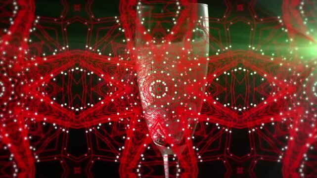 Animation of shapes and confetti over glass of champagne