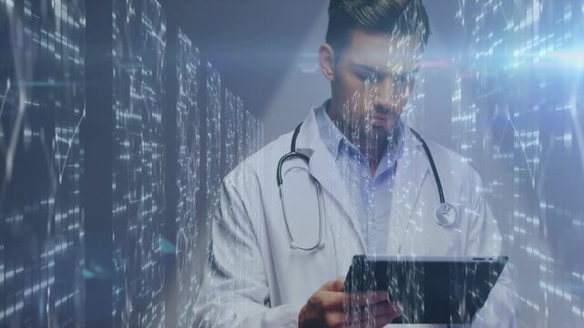 Male physician tapping tablet in clinic, generating data-matrix while reviewing vitals
