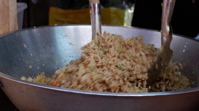 Popular Filipino street food consisting of fried rice, vegetables, and condiments sold on the streets.