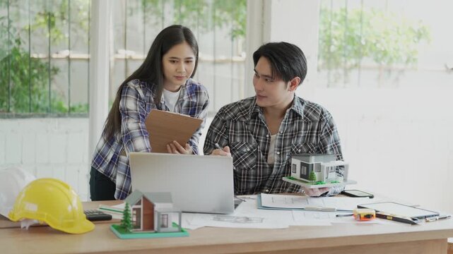 Engineers, architects, and technicians are analyzing structural design drafts in meetings with tabletop blueprints and discussing the project collaboratively in office meetings.