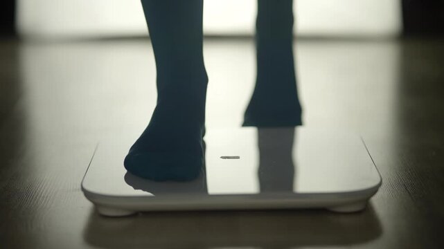 Athlete Standing On Digital Floor Scales To Check Weight. Weight Loss Journey And Daily Monitoring Routine