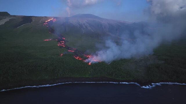 France - Reunion Island - Volcanic eruption, lava in the forest - orbit left from the sea