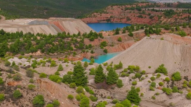 Turquoise water quarry lake mineral patterns aerial drone Greece