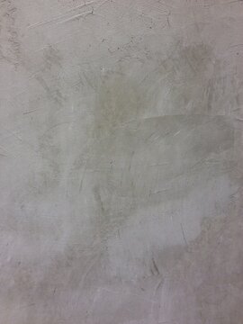 gray cement wall with rough scratched texture