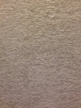 gray stone surface with rough texture and speckles