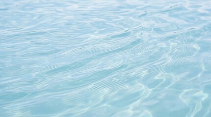 Fototapeta premium Calm and Clear Blue Water Surface with Gentle Ripples and Reflections