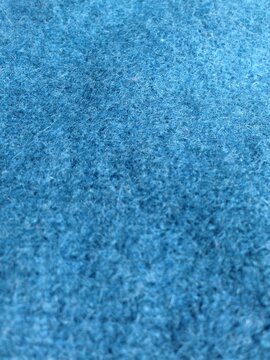 close up of blue fuzzy fabric with soft texture