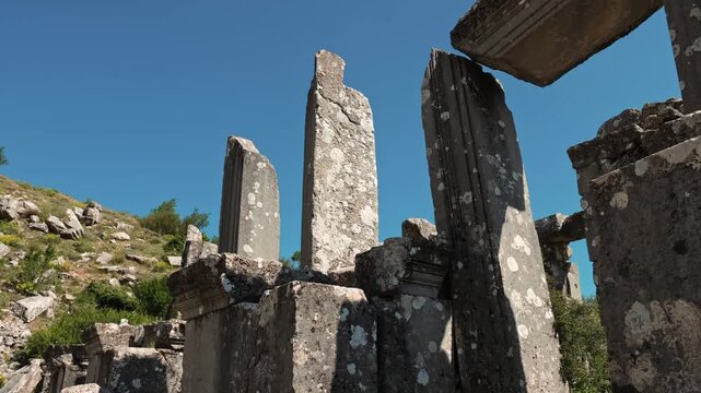 Detailed view of ancient stone column ruins at Termessos Ancient City in Antalya, Turkey. Historic architectural remains blending with nature in the mountainous Pisidia region.