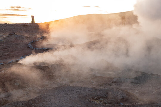 Dramatic sol de manana sunrise over geothermal geyser steam field