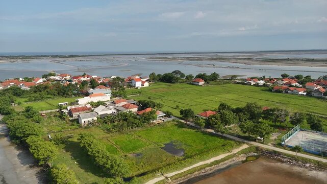 Aerial View of Coastal Village and Fish Ponds in Indonesia