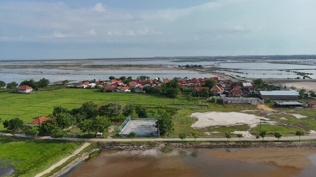 Aerial View of Coastal Village and Fish Ponds in Indonesia