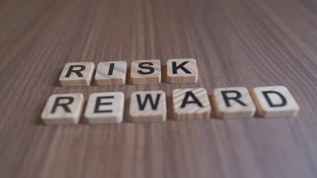 "Cinematic focus shifts between the wooden words RISK and REWARD on a rustic background."