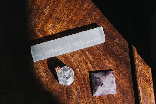 A set of natural minerals for treatment. Healing crystal stones on the background. Quartz and amethyst. Alternative medicine, esoteric