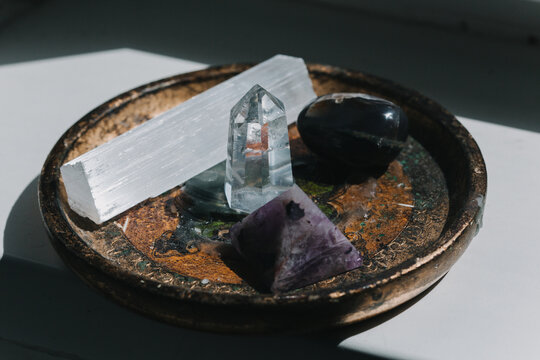 A set of natural minerals for treatment. Healing crystal stones on the background. Quartz and amethyst. Alternative medicine, esoteric