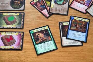 Fototapeta premium WARSAW, POLAND - MARCH 19, 2026: Cards of Harry Potter Trading Card Game, a collectible card game based in the world of Harry Potter novels. It was published by Wizards of the Coast.