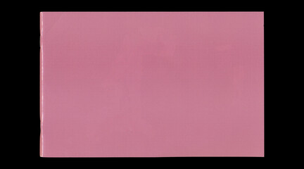 Fototapeta premium Wide closed pink notebook cover on black background