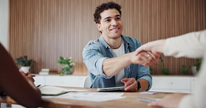 Tablet, handshake and business man in meeting for deal, partnership or agreement in startup office. Smile, tech and people shaking hands for cooperation, trust or support with creative collaboration