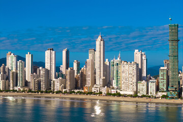Obraz premium Skyline With High Rise Buildings in Front of the Beach With Blue Sky in Balneario Camboriu City in Brazil
