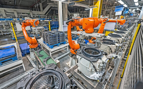 Robotic Arms Assembling Automotive Parts in Factory Workshop