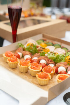 Luxury gourmet appetizer table featuring elegant canape and finger foods beautifully arranged for an outdoor event. High quality catering concept for weddings, receptions, and promo use