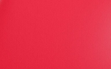 Fototapeta premium Close-up view of a textured red fabric with subtle grainy appearance