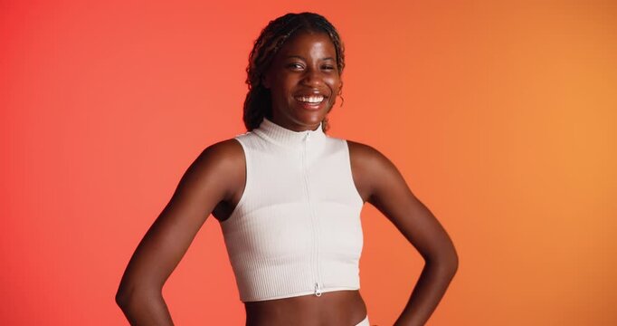 Face, confidence and black woman in studio for fitness, exercise and laugh on background. Portrait, happy athlete and funny African American person with smile for health, workout and mockup space