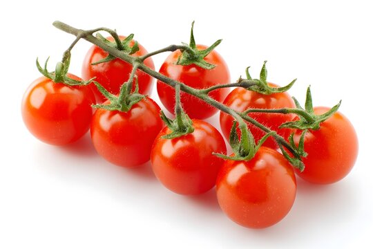 A bunch of ripe red cherry tomatoes growing on the vine with green leaves