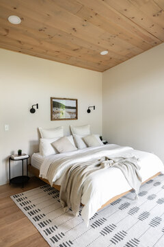 A modern interior of a bedroom in a getaway cabin.