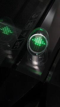 Green LED Arrow Sign on Moving Escalator