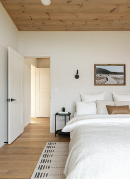 A modern interior of a bedroom in a getaway cabin.