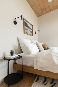 A modern interior of a bedroom in a getaway cabin.