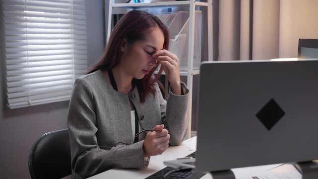 Tired Woman Taking off Glasses and Closing Eyes to Relieve Fatigue After Long Hours of Working