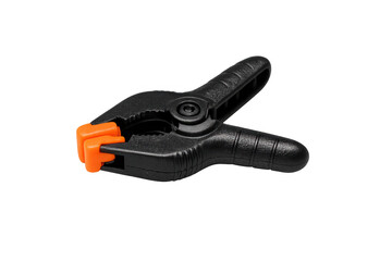 Obraz premium Black spring clamp with orange grip on transparent background
