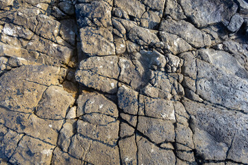 Fototapeta premium Cracked rock geological pattern showing natural texture