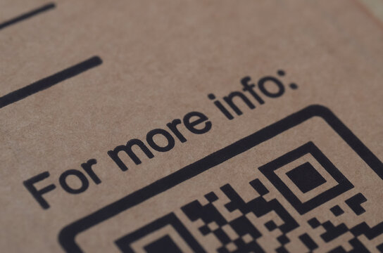 Close up of QR code on brown cardboard packaging for digital information